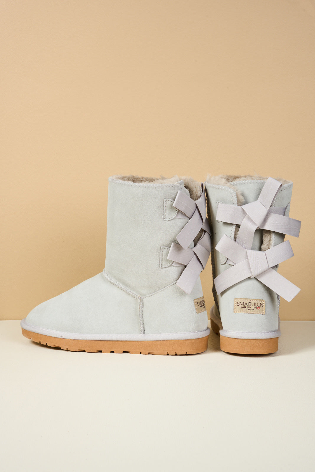 UGG Double Ballet Ribbon Bow Suede Shearling Boots - Pale