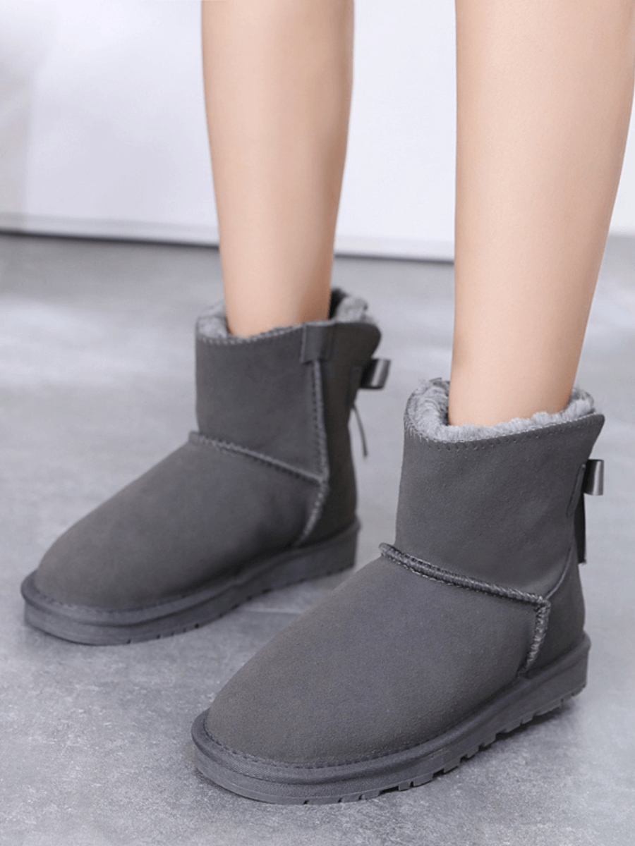 UGG Ribbon Bow Faux Fur-Lined Mini UGG Boots